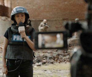 Pov,Camera,View,,Female,War,Journalist,Correspondent,Wearing,Bulletproof,Vest