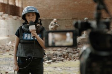 Pov,Camera,View,,Female,War,Journalist,Correspondent,Wearing,Bulletproof,Vest