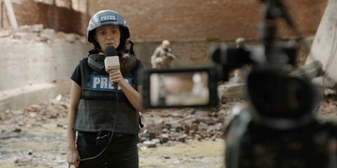 Pov,Camera,View,,Female,War,Journalist,Correspondent,Wearing,Bulletproof,Vest