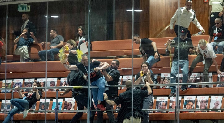 Hostages’ relatives throw paint in Knesset to mark grim milestone