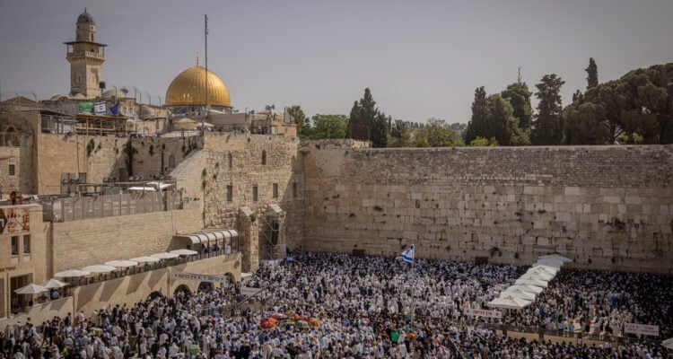 ‘The people of Israel need the blessings now more than ever’: Jews flock to Western Wall