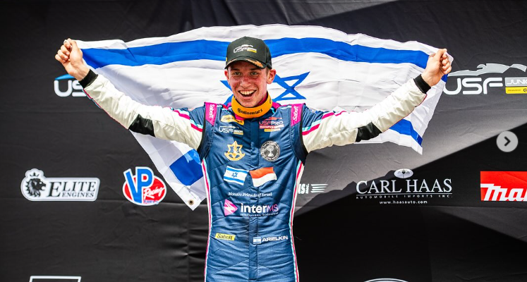 Israeli race car driver finishes 3rd in international race, wears Hamas hostage photos on his helmet
