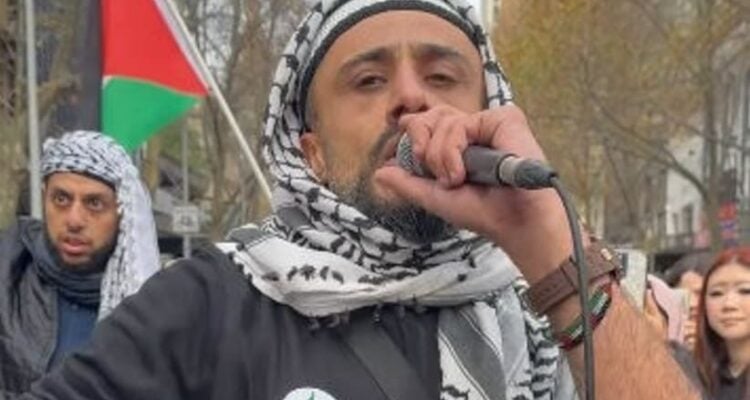 Anti-Israel activist suspected of kidnapping, torture spotted at rally wearing Hamas emblem