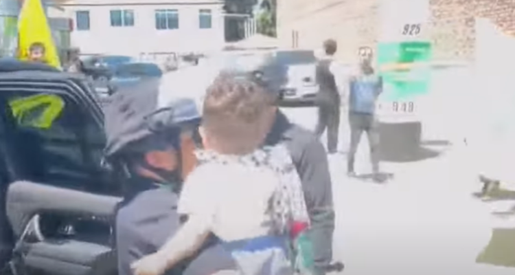 Anti-Israel protesters with keffiyeh-wearing toddler arrested after blocking entrance of an LA synagogue