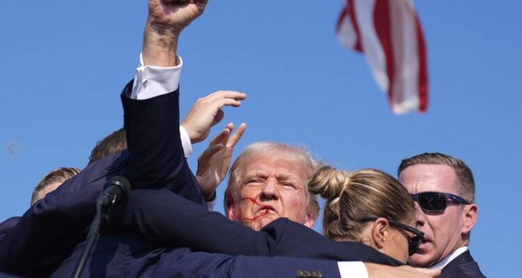 Bloodied Trump whisked off rally stage as gunshots rang through crowd