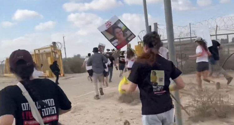 Screaming towards captive relatives, hostage families rush Gaza border during protest march