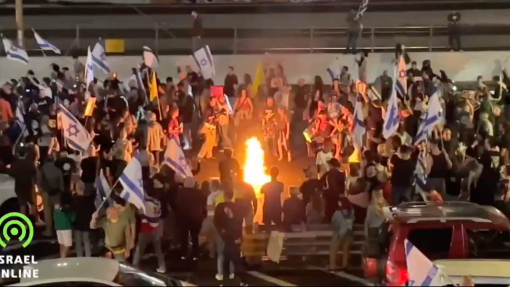 WATCH: Protesters start fires, block highway after Netanyahu fires defense minister