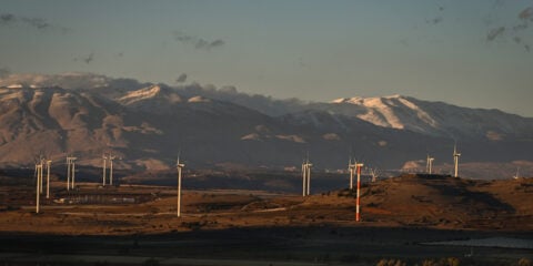 A station of wind turbines with snowy Mount Hermon in the background in the Golan Heights, November 26, 2024. Photo by Michael Giladi/ Flash90