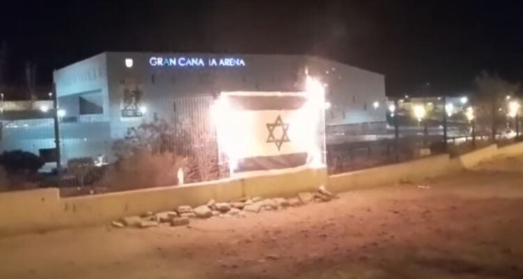 Spanish Palestinian supporters burn Israeli flags ahead of Eurocup match