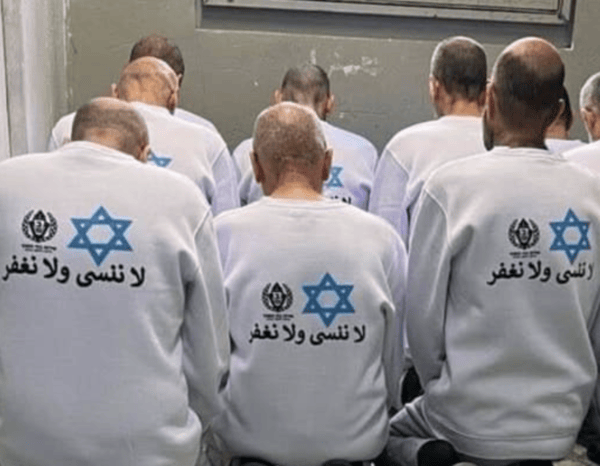 Freed Palestinian terrorists made to wear shirts with writing in Arabic 'We will not forget nor forgive' (credit: Israel Prison Service)