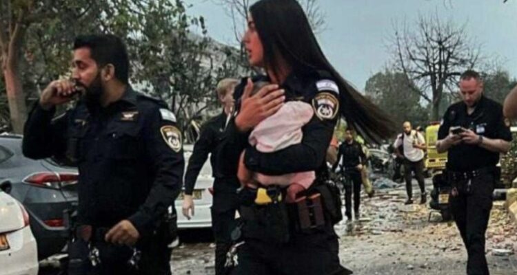 Israeli rescue team pulls baby from rubble after missile barrage
