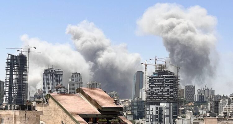 Israel retaliates after Iran barrages, hits power station, infamous Tehran prison, and state media