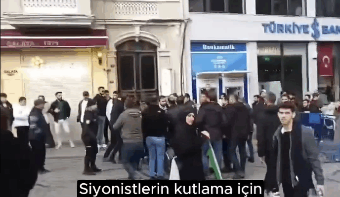 Turkish activists harass Jews outside synagogue, try to prevent Chanukah candle-lighting