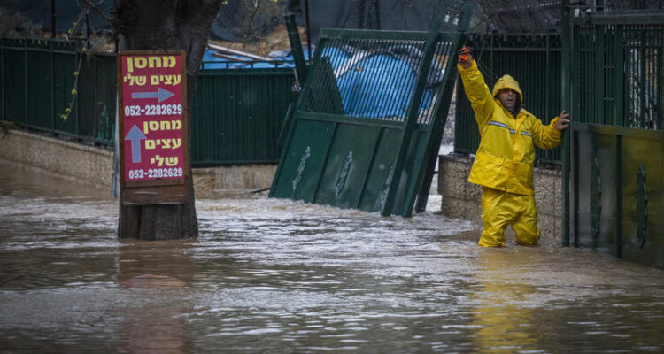 Flooding and high winds disrupt roads and flights as storm sweeps Israel