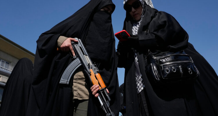 Iran uses gun-toting militia members to project power as Trump hints at strikes