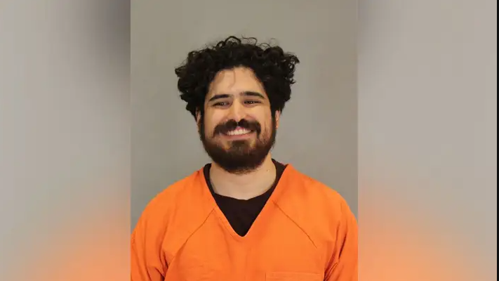 Trump UFC assassination suspect seen beaming in mugshot