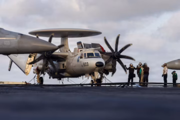 U.S. Sailors conduct maintenance on an E-2D Hawkeye ( U.S. Navy)