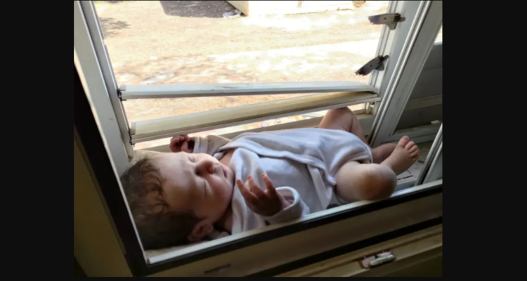 Baby in iconic October 7 photo finally returns home to kibbutz